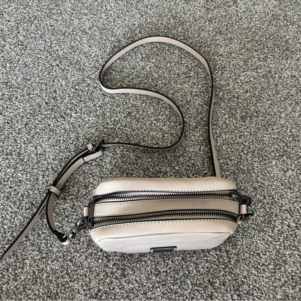 Cream Crossbody Bag with Adjustable Strap and Modern Design